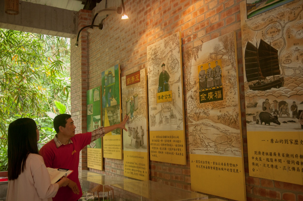 Workshop staff introducing the history of making paper from bamboo