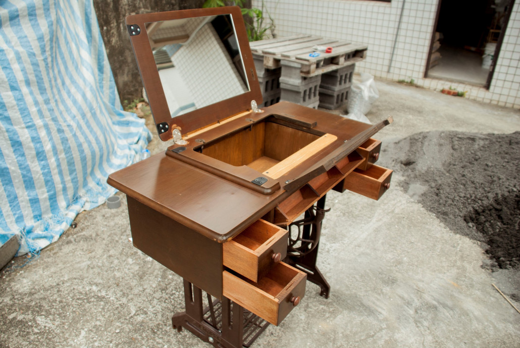 An old sewing machine turned into a dressing table